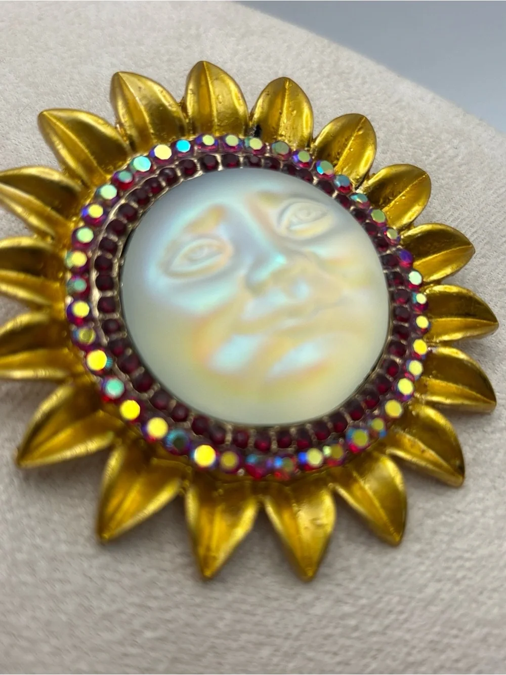 Iridescent Moon Face Sunburst Fashion Brooch with Ruby Colored Aurora Rhinestone